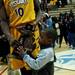 Ypsilanti junior Jaylen Johnson shares the trophy after winning the division championship on Friday, March 8. Daniel Brenner I AnnArbor.com